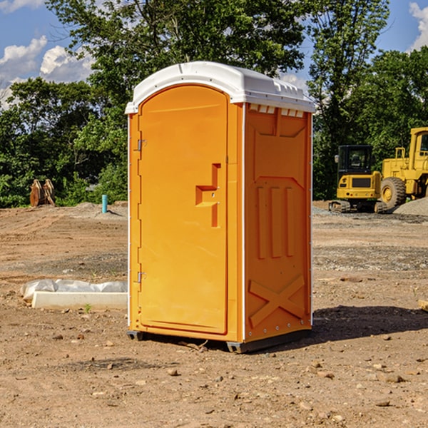 what is the cost difference between standard and deluxe portable restroom rentals in Adeline